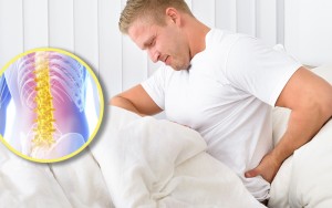 man-in-bed-with-hurt-back